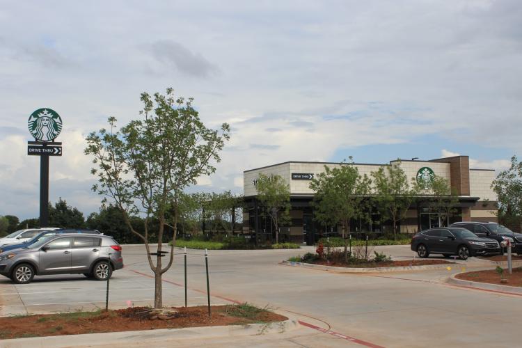 Shoppes at East Covell retail space for lease Edmond, OK exterior photo of Starbucks adjacent to center